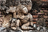 Thailand, Old Sukhothai - Wat Mahathat, stucco figures that decorate the base of the multi-layered chedi to the South of the complex. 